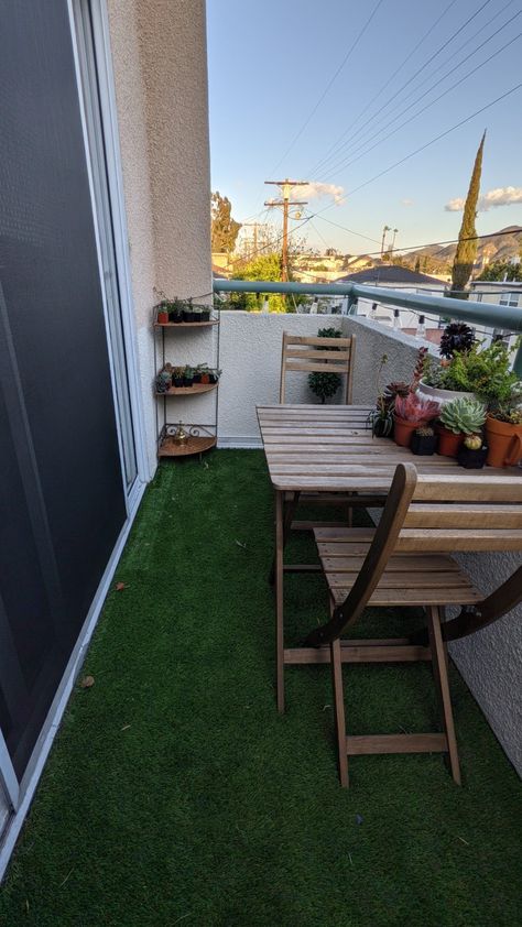 An empty patio I put turf on as well as a patio set. Turf Apartment Balcony, Turf Balcony Ideas Apartment, Grass Turf Balcony, Turf Porch Ideas, Balcony Turf Ideas, Turf Patio Ideas Apartment, Turf On Patio, Patio Turf Ideas, Balcony With Turf