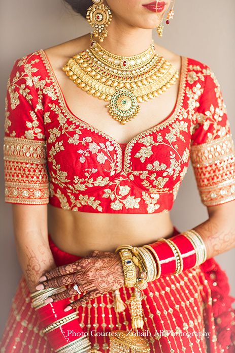 Red Sabyasachi lehenga with chooda and Kaleere for wedding Blouse Designs Latest Sabyasachi, Sabhyasachi Latest Blouses, Red Bridal Lehenga Blouse Designs, Indian Bridal Lehenga Blouse Design, Sabyasachi Bridal Blouse, Sabyasachi Style Blouse, Bride Wedding Blouse Designs, Bridal Lehenga Blouse Designs Back, Bride Lehenga Blouse Designs