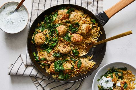 With nutty orzo, tender meatballs, bitter greens and spoonfuls of herby yogurt, this Mediterranean-inspired skillet dinner is hearty yet light There’s an incredible amount of dill, but don’t bother plucking fronds from the stems Instead, chop the whole plant until you hit the roots; the stems are crunchy and flavorful Lemon Dill Meatballs, Dill Meatballs, Chicken Meatballs With Orzo, Lemon Dill Chicken, Spicy Honey Chicken, Dill Chicken, Chicken Fried Rice Easy, Orzo Recipe, Tender Meatballs