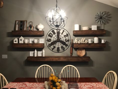 Floating wood shelves. Large clock decor Floating Shelf Ideas, Dining Room Clock, Large Wall Clock Decor, Clock Decor Ideas, Large Wall Decor Living Room, Dining Room Shelves, Floating Shelves Living Room, Wood Dining Room, Kitchen Decor Wall Art