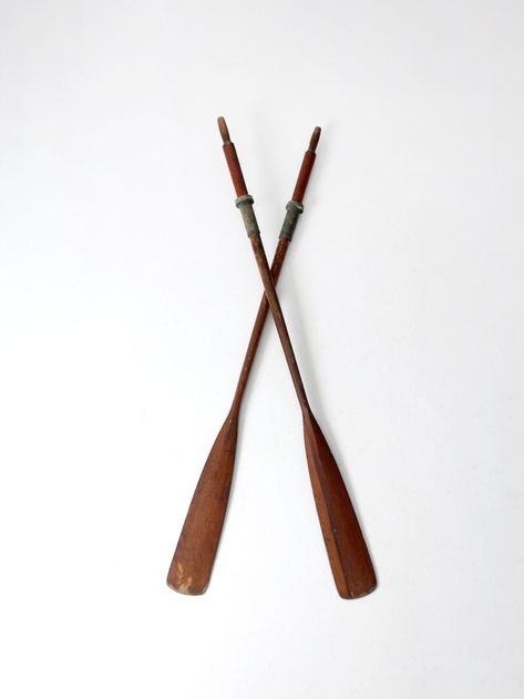 "This is a pair of vintage wooden oars.  The classic nautical oars have a warm russet brown tone with black rubber grips and metal stops. Mount on the wall, or display standing for an eye-catching nautical look. From our Heritage Collection CONDITION In good condition with wear consistent with age and use. General scuffs and wear and some paint splatter. MEASUREMENTS Height:  72.25\"  ..  183.5 cm Width:  5.25\"  .. 13.3 cm Depth: 3\"  .. 7.6 cm SHIPPING International and non-contiguous US customers, please contact us for options and pricing based on your location.  32328" Oars Decor Ideas, French Candlesticks, Wooden Oars, Boat Oars, Nautical Looks, Windsor Chair, Vintage Candlesticks, Brown Tone, Unusual Plants