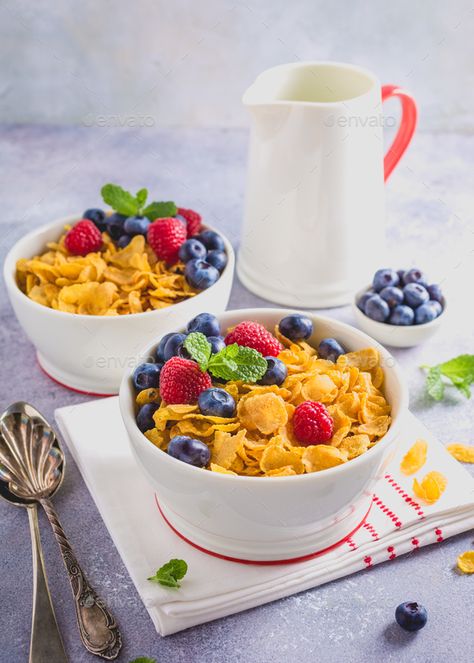 Healthy breakfast with corn flakes and berries by Merinka. Corn flakes with berries and milk on light gray background. Copy space. Healthy breakfast concept. #AD #berries, #Merinka, #Corn, #flakes Blue Blue Background, Light Gray Background, Corn Flakes, English Food, Breakfast Cereal, A Bowl, Gray Background, Blueberries, Food Styling