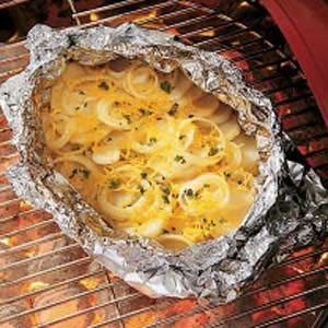 Campfire Potatoes Recipe from Taste of Home -- shared by JoAnn Dettbam of Brainerd, Minnesota Campfire Potatoes, Campfire Food, The Onion, Think Food, Potatoes Recipe, Camp Cooking, On The Grill, Potato Dishes, Camping Food