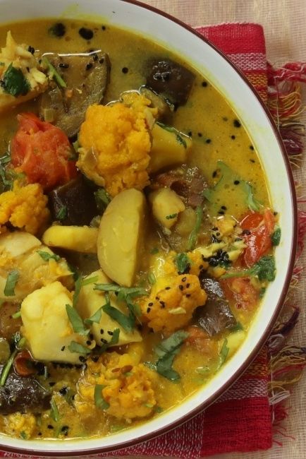 This fish curry is an essential recipe, loaded with vegies, think baby potatoes, cauliflower, sweet potatoes and eggplants all in a happy marriage in a ginger and coconut broth. It is a recipe you with find in my Bengali cookbook - The Bengali Five Spice Chronicles and you will of course find it on the blog. #fishstew #fishcurry #curries #easyrecipes #glutenfree #glutenfreerecipes #lentenmeals #lightandlively #panchphoron #bengalifood #bengalicooking Bengali Fish Curry, Coconut Broth, Recipes With Vegetables, Coconut Fish, Bengali Recipes, Five Spice, Bengali Food, Green Eating, Fragrant Garden