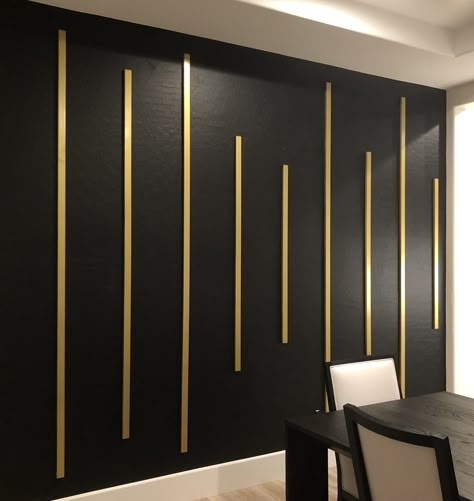 Black Wall With Gold Lines, Black And Gold Panelling, Accent Wall Black And Gold, Black Gold White Art, Black And Gold Wall Paint Ideas, Black Wall With Gold Accents, Bar Room Ideas In House Luxury, Conference Room Wall Design, Black And Gold Accent Wall