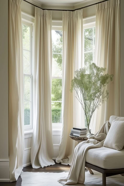 Serene bay window setting with flowing sheer linen curtains, bringing a calm and elegant feel to the room. Window Treatments For Bay Windows, Curtains For Living Room Windows, Bay Window In Living Room, Bay Window Curtain Ideas, Living Room With Bay Window, Bedroom Bay Window Ideas, Bay Window Decorating Ideas, Bay Window Dressing, Curtains Bay Window