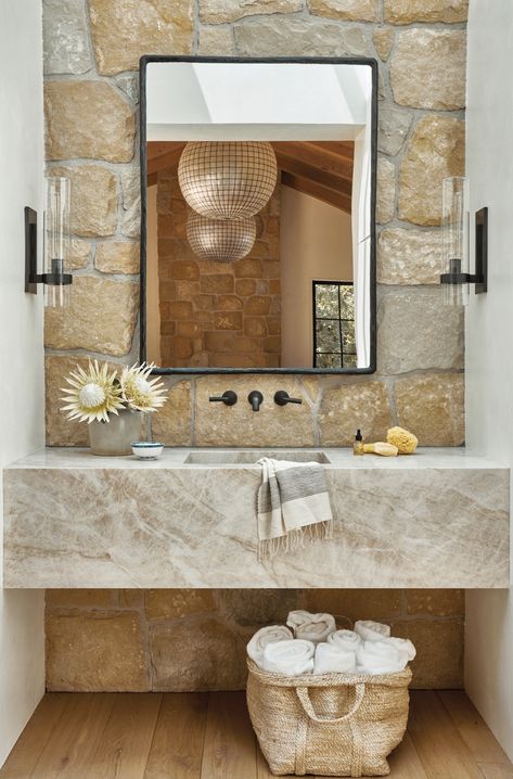 The same stone composes the floating vanity, backed by walls of Santa Barbara sandstone, an homage to the local vernacular. Rh Sofa, Bronze Shower Head, Modern Cottages, Portola Paint, Modern Tree House, Unique Kitchen Backsplash, Sandstone Wall, White Washed Oak, Huge Library