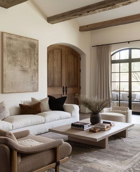 Rustic elegance meets modern comfort. This living room seamlessly combines rustic charm with modern elegance. The exposed wooden beams and earthy tones create a warm, inviting atmosphere, while the minimalist furniture and decor add a touch of contemporary sophistication. The trick to achieving a balanced rustic-modern look? Blend natural materials like wood and stone with clean-lined furniture and neutral colour palettes. What do you love most about this style fusion? Let us know in the c... European Living Room, Earthy Living Room, Wooden Living Room, Modern Rustic Homes, Interior Design Rustic, H Design, Minimalist Furniture, Wooden Beams, More Design