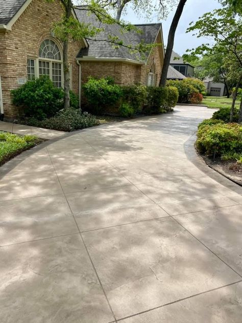 A TEXTURE-PAVE™ Decorative Concrete Overlay was specified for this Driveway to maintain superior resistance to direct UV rays and fluctuating freeze/thaw climate. This beautiful and durable coating is the perfect for large areas like this one. Driveway Tiles, Stained Concrete Driveway, Driveway Entrance Landscaping, Stamped Concrete Driveway, Concrete Patio Makeover, Concrete Overlay, Pool Remodel, Driveway Design, Stamped Concrete Patio