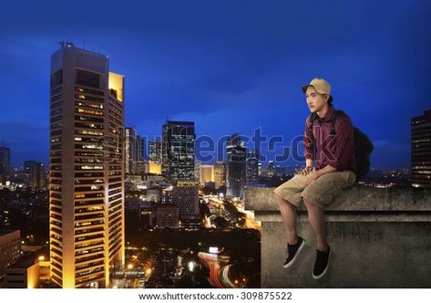 Find Male Tourist Sitting On Building Rooftop stock images in HD and millions of other royalty-free stock photos, illustrations and vectors in the Shutterstock collection. Thousands of new, high-quality pictures added every day. Sitting On Top Of Building, Sitting On Rooftop, Rooftop Illustration, On Top Of Building, Top Of Building, Building Rooftop, New York Skyline, Photo Image, Royalty Free Stock Photos