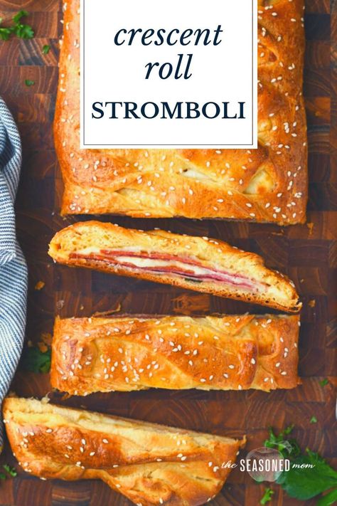 This easy crescent roll stromboli has all of the Italian meats and cheeses that you love in a classic stromboli recipe! Store-bought crescent roll dough is brushed with garlic butter, stuffed with ham, pepperoni, salami, Provolone, and mozzarella, and then baked in the oven until it's puffy, flaky, and golden brown. Serve the homemade stromboli sandwich with a side of marinara for a quick dinner, a fun party appetizer, or a simple gameday snack! Stromboli With Crescent Rolls, Crescent Roll Stromboli, Stromboli Sandwich, Sheet Recipes, Crescent Braid, Cheese Stromboli, Easy Stromboli, Stromboli Recipe Easy, Crescent Roll Recipes Dinner