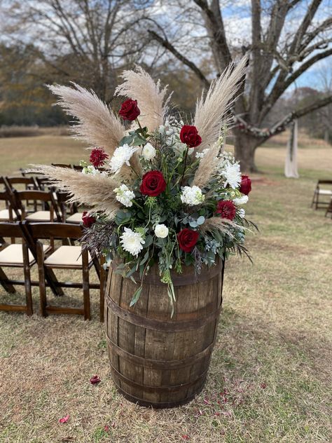 River Rock Wedding Centerpieces, Maroon Western Wedding Theme, Boho Barrel Wedding Decor, Western Wedding Burgundy, Burgundy Rustic Wedding Centerpieces, Wiskey Barrell Ideas Flowers Wedding, Burgandy Wedding Decorations Rustic, Burgundy Rustic Wedding Decorations, Western Aisle Decor