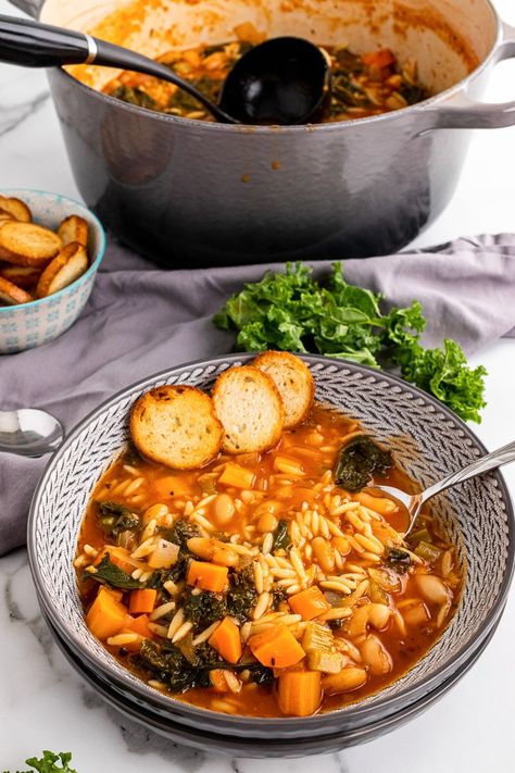 Whip up a batch of this delicious Tuscan kale soup with orzo! Loaded with nutrient rich vegetables, savory broth, and tender orzo in each bite. Tuscan Kale Soup, Soup With Orzo, White Bean Kale Soup, Soup Store, Kale Soup Recipes, Tuscan Kale, Tuscan Soup, Soup Beans, Leftovers Soup