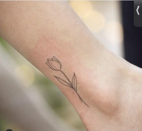 Tulip Tattoo On Ankle, Tiny Tulip Tattoo, Minimalist Tulip Tattoo, Fine Line Tulip Tattoo, Flower Outline Tattoo, Pisces Tattoo Designs, Mum Tattoo, Side Wrist Tattoos, Iris Tattoo