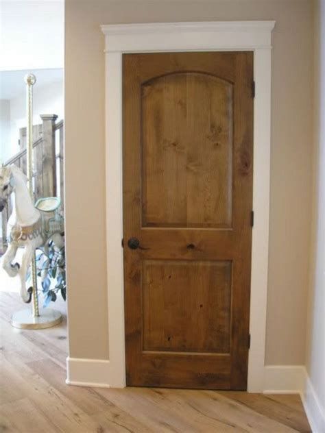 White trim and dark wood doors. Wood Stained Interior Doors With White Trim, Dark Wood Doors With Light Wood Floors, Dark Trim With Light Wood Floors, Light Stained Doors, Wood Stain Doors Interior, Farmhouse Internal Doors, Stained Doors Interior, Knotty Alder Doors With White Trim, Dark Wood Interior Doors