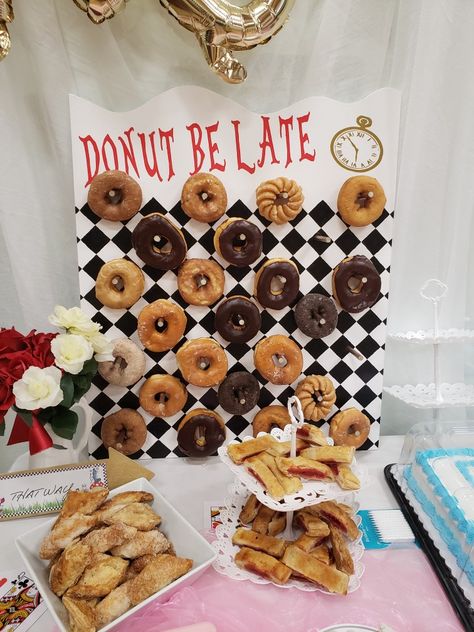 First birthday party - Alice in wonderland donut wall - donut be late Donut Be Late Alice In Wonderland, Simple Alice In Wonderland Party, Alice In Onederland First Birthday Tea Party, Alice In Wonderland Themed Food Ideas, Yea Party Alice In Wonderland, Alice And Wonderland First Birthday Party, Onederland Birthday Food Ideas, Alice In Wonderland Gender Reveal Ideas, Alice In Wonderland Veggie Tray