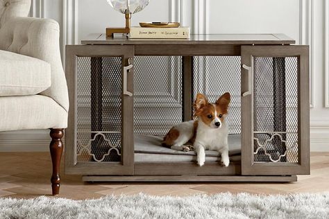 If you’ve ever lived with a dog that needed to be crated, you totally understand how awful it is to live with a giant cage in your home. It sticks out (because when is it ever normal to have a cage in a room?). It somehow always looks messy. And your pup usually looks woefully sad when he's inside the metal contraption. To be fair, crates can be quite beneficial for some dogs. A lot of dogs enjoy it and find comfort in being crated. It's just the whole cage thing. Optics, you know? Decorative Dog Crates, Kennel Furniture, Furniture Style Dog Crate, Crate End Tables, Wooden Dog Crate, Wooden Dog House, Dog Crates, Dog Crate Furniture, Crate Furniture