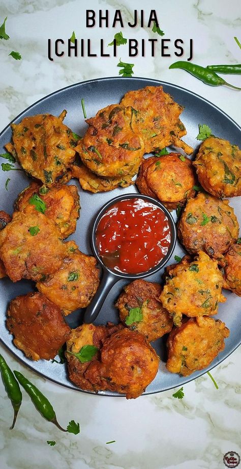 Bhajia (Chilli Bites) Recipe: https://youtu.be/kf3W-XA7N8U

Bhajia (Chili Bites) is a fiery Indian snack or entree dish like a fritter, with a few variations.

It is normally served as a topping with different Indian meals, however it is well known to be eaten alone as a snack. It is preferably eaten on cold winter days as it is a comfort snack. Chilli Bites, South Indian Snacks Recipes, Snacks Around The World, Dinner And Lunch Recipes, 1 Pan Meals, South Indian Snacks, Entree Dishes, Indian Meals, Step By Step Recipes