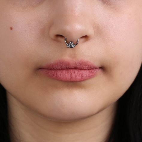 "This tiny sparkling Bee Nose Clicker is fantastic for daily use. These glittering pieces are premium, luxurious and designed to be the crown jewel of your personal collection. Those make them a great gift for her, for any occasion such as Christmas, valentine days, special occasions. I can be used as Nose Stud, Tragus Stud, Helix Stud, Conch The glamorous bee septum clicker is sold as a single piece not in pair. This item can be used for Septum, Helix, Daith & more The bar thickness is 1.2 mm ( Nose Hoop Piercing, Nose Ring Designs, Daith Hoop, Hoop Piercing, Valentine Days, Septum Nose Rings, Tragus Stud, Dazzling Earrings, Daith Earrings