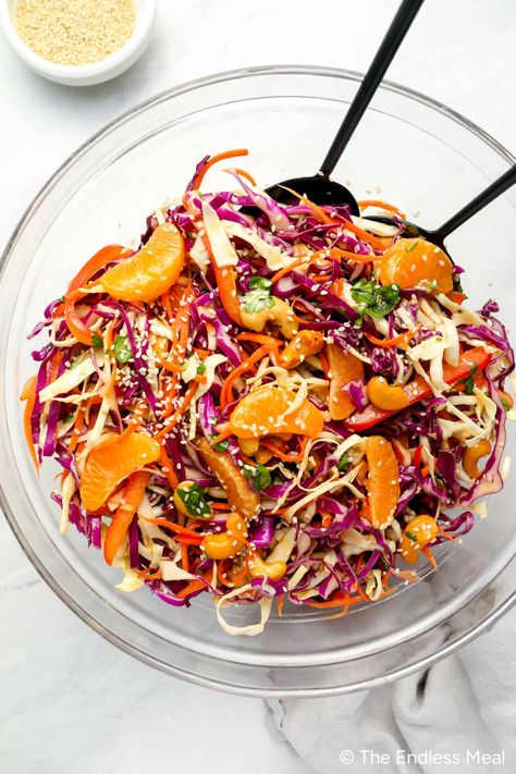 This 20-minute Asian coleslaw will be a hit. It's colorful, vibrant, refreshing, and packed with delicious flavors. An array of nutritious veggies and mandarin oranges are tossed in the most divine orange sesame dressing. #theendlessmeal #salad #coleslaw #dinner Recipes With Mandarin Oranges, Asian Coleslaw Recipe, Chinese Cabbage Salad, Mandarine Recipes, Asian Cabbage Salad, Asian Cabbage, Salad For Summer, Asian Chopped Salad, Asian Salad Recipe