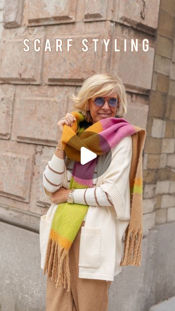 Sophie Van de Vyver on Instagram: "How to wear/style a thick rectangle winter scarf🧣 - save this styling tip for the stylish winter days ahead✔️

All styles & scarf in this video @mayerlinebrussels 

#over50style #daretofeelperfect #mayerlinemyfit #mayladies #scarfstyling #mayerlinebrussels #embraceagiantspirit #howtotieascarf #scarfknot #plaidscarf #sophisticatedstyle #getinspiredbystyle #50plusstyle #ikkoopbelgisch #wardrobestylist #fashionstyleblogger #scarftutorial" How To Wear A Big Scarf, How To Wear Big Scarves, Tying Large Scarves, Large Square Scarf Tying Ideas, Tie A Winter Scarf, Large Scarf Tying, How To Tie Western Style Scarf, How To Tie A Thick Scarf Winter, How To Wear A Blanket Scarf