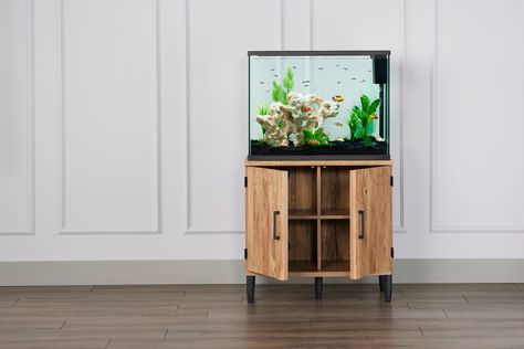 The Top Fin Sindoori Mango Finish Aquarium Stand was designed with your home in mind to better display the beauty of your underwater world. This beautiful piece is expertly crafted, and seamlessly blends function and style into your home. Only at PetSmart. Features: Water-resistantAmple storage space with cord managementEasy assembly Includes: 1 Aquarium StandIntended Pet(s): FishColor: BrownProduct Dimensions: Assembled: 31.2 in W X 17.5 in D X 30 in H (79.2 X 44.4 X 76.2 cm)Capacity: Up to 36 Modern Fish Tank, 10 Gallon Fish Tank, Aquarium Stands, Fish Color, Fish Tank Stand, Fresh Water Fish Tank, Tank Stand, Aquarium Stand, Betta Fish Tank