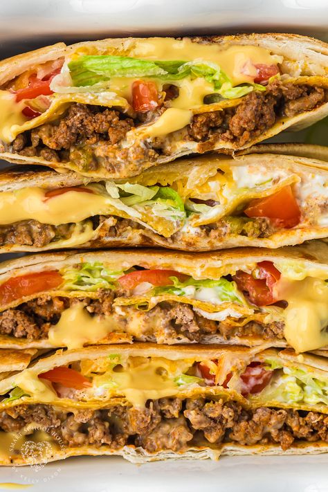 Crunchwrap Supreme is a deliciously wrapped tortilla that features beef, warm nacho cheese, crisp lettuce, fresh tomatoes, and sour cream! Nacho Cheese Beef Wrap, Wraps With Cream Cheese, Healthy Crunchwrap, Homemade Crunchwrap, Crunchwrap Supreme, Beef Wraps, Crunch Wrap, Homemade Crunchwrap Supreme, Cheese Crisps