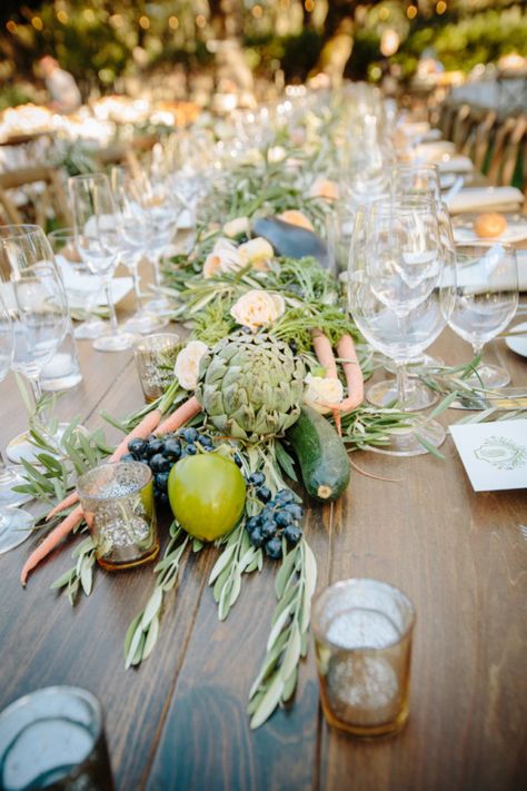 Foraging Fashion: This garland of olive leaves and peach roses was embellished with freshly grown fruits and vegetables from Beltane Ranch. Bride Ali Canty asked of designer/planner Alicia K Designs that “anything (they) can gather from the gardens” be included in the design. (Photo courtesy of Michelle Walker Photography) Cottagecore Wedding Decor, Wedding Stand, Cottagecore Wedding, Vegetable Stand, Unique Vegetables, Garden Theme Wedding, Olive Leaves, Sonoma Wedding, Food Party