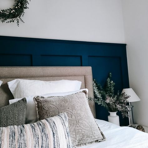 Dark blue panelled bedroom mixed with neutral cushions and headboard Blue Panel Wall Bedroom, Panelled Walls Bedroom Blue, Blue Wall Panelling Bedroom, Blue Bedroom Panelling Ideas, Bedroom Blue Panelling, Panneling Rooms Bedroom Blue, Blue Panelling Bedroom, Blue Panelling, Panelled Bedroom