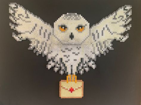 Hedwig Harry Potter perler bead art Flying owl Harry Potter Perler Bead Patterns Hedwig, Hedwig Perler Bead Pattern, Owl Perler Bead Patterns, Perler Harry Potter, Hama Beads Harry Potter, Owl Perler, Harry Potter Perler Beads, Hama Art, Christmas Perler Beads