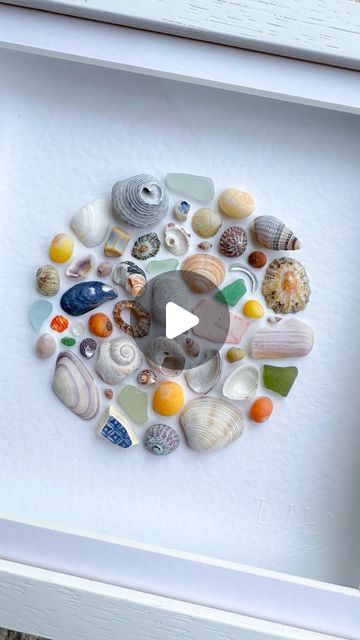 Nicola Fewings | Luxury Shell & Sea Glass Art📍Cornwall on Instagram: "Here it is!  A lovely previous customer of mine messaged to ask if I’d like to donate anything to the fundraiser she was doing for an Alzheimer’s charity. She’s running the London Marathon to raise money and I’m in awe of anyone who can do that, so I said yes 🩷  Here’s the artwork that will be sent off to its new owner soon.  #circularart #circleart #shellart #seashells🐚 #seashellcollection #shellcollection #marineplastic #cornishseaglass #blueseaglass #greenseaglass #limpets #mussels #periwinkles #cornishbeaches #seashelladdict #seashellart #oceanart #coastalartwork #coastalhomedecor #coastalinterior #artforinteriordesign #artforinterior #undertheseatheme #seatheme #lilyandsea" Alzheimers Art Projects, Shell Frame Diy, Seashell Projects Artwork, Sea Glass And Shell Art, Sea Shell Crafts Seashell Art, Shell Pictures, Shells Craft, Seashell Artwork, Sea Glass Artwork