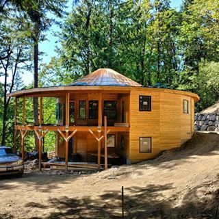 Super excited to check out the progress on the  story wooden yurt house I designed a couple years ago in Issaquah WA The steep slope made for a formidable design and construction challenge but its coming along amazingly wellyurt woodenyurt wood house home residential architecture design designbuild dreamdesignbuild Issaquah WA PNW PacificNorthWest Yurt Home, Yurt Living, Soul Journey, Eco Architecture, Earth Homes, Cabins And Cottages, Round House, Eco House, Eco Friendly House