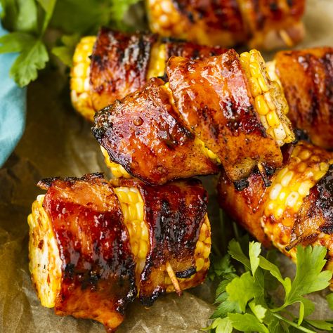 Sweet & Spicy Bacon Wrapped Corn On The Cob -- does it get any better than bacon + corn + a sweet & spicy honey chipotle glaze? THIS is the recipe that all your guests will be asking for after your next cookout! | grilling recipes | summer grilling recipes | corn on the cob on the grill | grilled bacon wrapped corn | corn on the cob recipes | find the recipe on unsophisticook.com Corn On The Cob Grill, Chipotle Glaze, Cob Recipes, Bacon Wrapped Corn, Grilling Vegetables, Recipes Corn, Spicy Bacon, Bacon Corn, Grilled Bacon