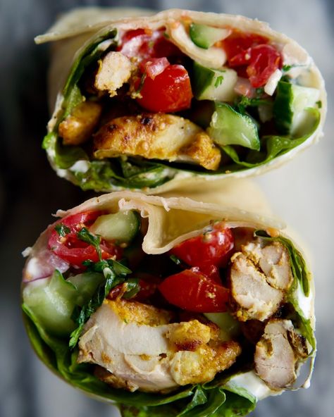 If you’re a fan of bold flavors and easy meals, then you’re going to love this fusion dish that combines classic Indian dishes in a burrito-style wrap. These Grilled Chicken Tikka Wraps are inspired by Indian chapati (flatbreads) wraps, but using the much more accessible burrito-sized flour tortillas. The wraps are filled with a grilled version of Meera Sodha’s chicken tikka from her cookbook Made In India, along with fresh kachumber (Indian tomato cucumber salad) and cooling raita (yogur... Chicken Tikka Burrito, Chicken Tikka Naan Wrap, Chicken Tikka Masala Burrito, Baja Chicken Wrap, Healthy Southwest Chicken Wraps, Meera Sodha, Fusion Dishes, Chicken Tikka, Chapati