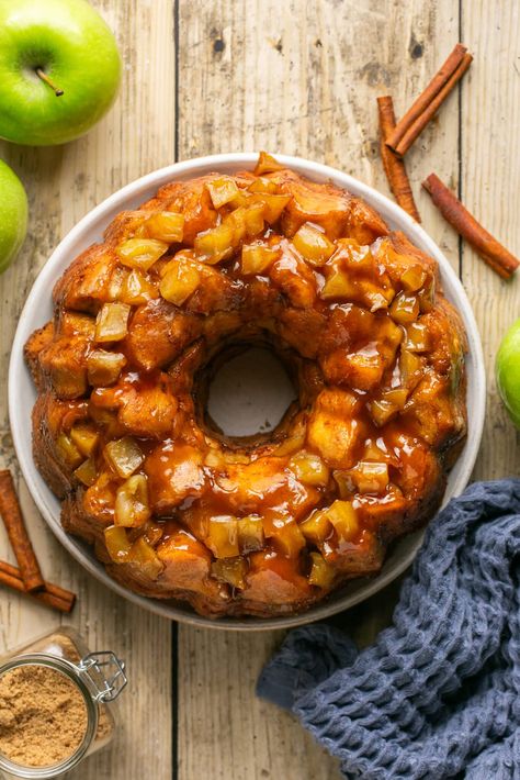 My Apple Cinnamon Monkey Bread is an indulgent treat perfect for breakfast, brunch, or dessert, and it's effortless to make! It's warm, ooey-gooey, with plenty of cinnamon-infused layers for family or guests to pull off individual pieces and enjoy. It will be devoured in no time! #monkeybread #pullapartbread #holidayrecipes Apple Cinnamon Monkey Bread Pillsbury, Sweet Monkey Recipes, Apple Cinnamon Monkey Bread, Grumpy Monkey, Mini Monkey Bread, Apple Monkey Bread, Cinnamon Monkey Bread, Cinnamon Roll Monkey Bread, Pillsbury Cinnamon Rolls