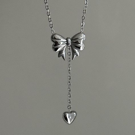 Bow Drop Heart Necklace  ✨ Fully stainless steel & tarnish proof! (18k gold plated/stainless steel) 15.5" with a 2" extender  oval link chain style featuring a unique mini puffed bow pendant & mini heart pendant 🤍 choose between silver or gold at checkout 😊 Handmade with love! Cute Silver Necklaces, Gift Bow Pendant Jewelry, Silver Sterling Silver Necklace With Bow, Elegant Sterling Silver Necklace With Bow, Silver Bow Necklace, Elegant Bow Pendant Necklace, K Jewelry, Silver Heart Jewelry, Silver And Gold Jewelry