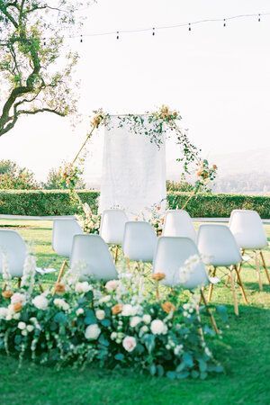 Modern outdoor wedding ceremony featuring a hexagon arch with flowers, pastel color palette and elegant floral aisle decor. See more on the blog! Ceremony Seating Ideas, Floral Aisle Decor, Outdoor Ceremony Seating, Average Cost Of Wedding, Arch With Flowers, Modern Outdoor Wedding, Wedding Flowers Cost, Cost Of Wedding, Hexagon Arch