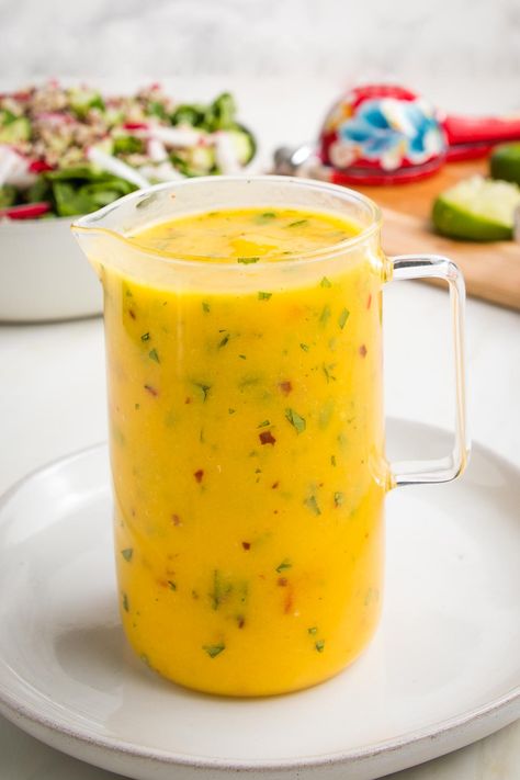 Looking for a sweet and tangy dressing to liven up your salads? Try our delicious mango salad dressing! Made with fresh or frozen mangoes and pineapple, this dressing is bursting with tropical flavors and is perfect for adding a touch of summer to any salad. With just the right amount of sweetness and acidity, it pairs perfectly with any green salad, avocados, strawberries or blackberries. Give it a try and see how it takes your salads to the next level. Raw Cauliflower Salad, Mango Salad Dressing, Mango Dressing, Homemade Salad Dressing Healthy, Balsamic Vinaigrette Recipe, Veggie Spring Rolls, Marinade Sauce, Mango Salad, Homemade Salads