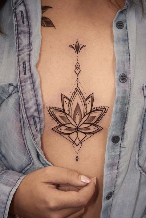 There are many variations of a lotus flower tattoo, but they all have one thing in common: they look simply wonderful. Check out our collection of the best lotus flower tattoos! #lotusflowertattoo #lotustattoo #tattoosforwomen #tattooideas Tattoo Between Breast, Simple Lotus Flower Tattoo, Lotus Flower Tattoo Meaning, Tato Mandala, Lotusblume Tattoo, Chest Tattoo Drawings, Small Lotus Flower Tattoo, Tato Tradisional, Lotus Flower Tattoo Design