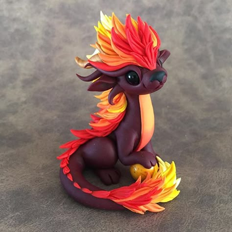 Here is the completed little fire fluff ball. That mane was intense! So much hand washing cuz RED ugh  #sculpture #dragonsandbeasties #polymerclay #cutedragon #orientaldragon #reddragon #firehair #firedragon #polymerclay Dragons And Beasties, Polymer Clay Dragons, Polymer Clay Kunst, Clay Creatures, Clay Dragons, Polymer Clay Dragon, Dragon Crafts, Clay Dragon, Polymer Clay Figures