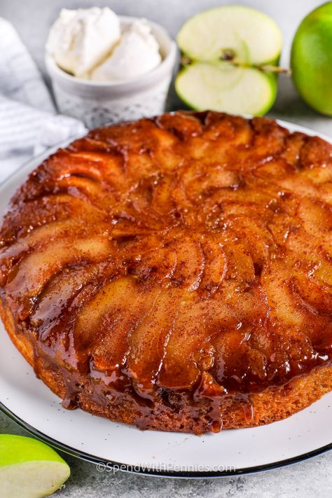 This recipe for apple cake is made in the style of an upside-down cake! Slices of cinnamon spiced apple are placed in the bottom of a pan with butter and brown sugar, then topped with a homemade yellow cake batter and baked until golden brown. Flip the pan and slip it off to reveal a layer of juicy, sticky, caramelized apples on top. The perfect dessert for apple-picking season! #applecakerecipeeasy #applecake #spendwithpennies #applecakerecipe #moistapplecakerecipes Apple Upside Down Cake Easy, Recipe For Apple Cake, Caramel Apple Upside Down Cake, Johnny Cakes Recipe, Apple Cake Recipe Easy, Homemade Yellow Cake, Apple Upside Down Cake, Upside Down Apple Cake, Apple Brown Sugar