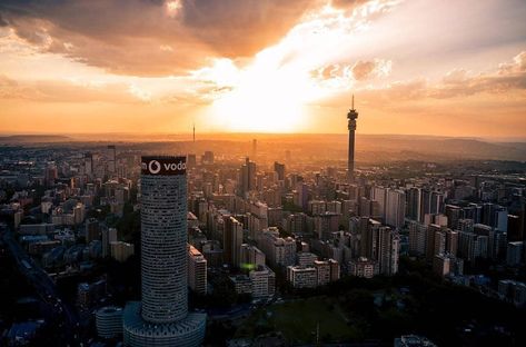 SouthAfrica on Instagram: “Jozi looking amazing at sunset.  Photo by @60seconds.travel #ThisIsSouthAfrica” Africa Sunset, Johannesburg City, Johannesburg South, Johannesburg, City Lights, Cn Tower, South Africa, Sunflower, Building