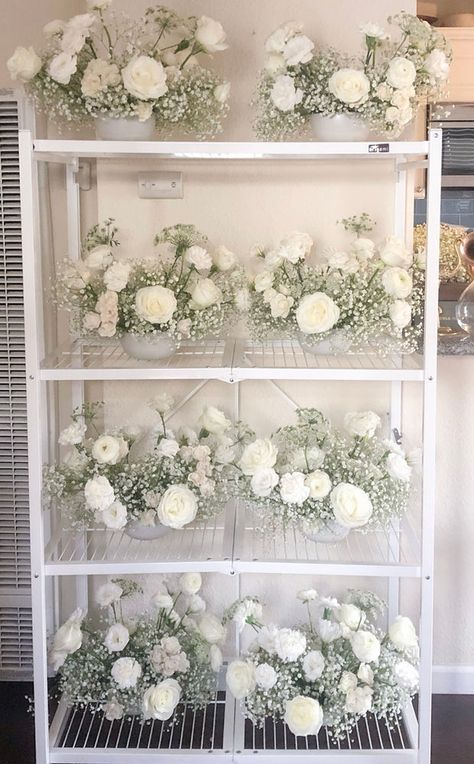 Baby's breath and white flower wedding centerpieces all lined up. 2023 Weddings, Wedding Flower Trends, White Roses Wedding, White Wedding Theme, Rose Centerpieces, Floral Trends, Wedding Floral Centerpieces, White Wedding Flowers, Flower Centerpieces Wedding