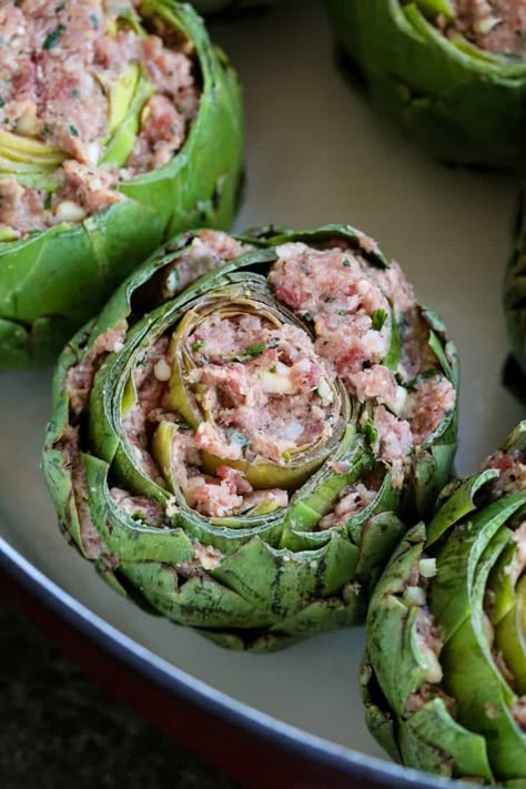 Grandma's Best Stuffed Artichokes are stuffed with a sausage and cheese before roasting in the oven. #stuffedartichokes #sausage #artichokes #sidedish #thanksgivingside #makeahead Stuffed Artichoke Recipes Italian, Artichoke Stuffed, Stuffed Artichokes Italian, Stuffed Artichokes, Stuffed Artichoke Recipes, Best Artichoke Recipe, Fried Artichoke, Baked Artichoke, Stuffing Ingredients