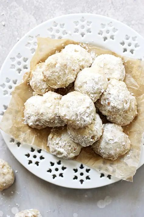 These buttery vegan snowball cookies are melt-in-your mouth perfection! And whether you call them snowballs, wedding cookies or russian tea cakes, this easy family favorite is a MUST for your holiday cookie trays! Packed with walnuts and dairy free. Dairy Free Christmas Recipes, Russian Cookies, Dairy Free Christmas Cookies, Dairy Free Cookie Recipe, Russian Tea Cookies, Russian Tea Cakes, Dairy Free Recipes Dessert, Russian Tea Cake, Mexican Wedding Cookies