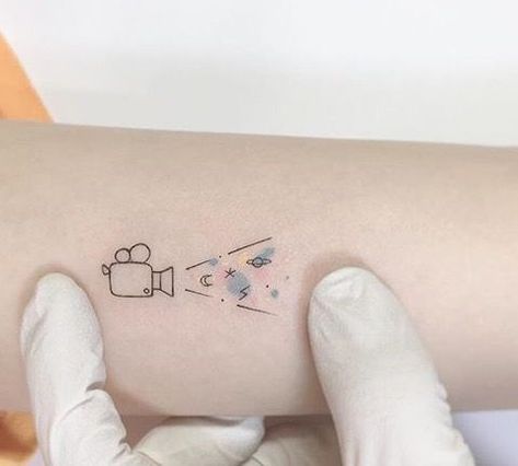 Cute Movie Tattoos, Tiny Movie Tattoos, Movie Ticket Tattoo Ideas, Movie Lover Tattoo Ideas, Movie Theater Tattoo, Cinephile Tattoo, Acting Tattoo Ideas, Cinematography Tattoo, Movie Camera Tattoo