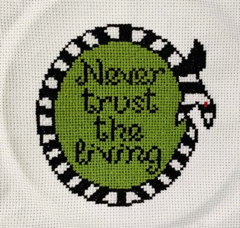 Cross Stitch Completed Finished, Hand Made!  -⌛🐍 Sandworm, Never Trust the Living  (Beetlejuice inspired) ⌛🐍-                Completed Cross Stitch Décor.  Ready to place in a frame and display. Ready to Sew onto a pillows, blankets, Jackets, Shirts and other cloth materials.  Hand Crafted With Care The Stitch work is a 8 inch x 8.75 inch -Just the completed Stitch Work- -No Frame included- -No Embroidery Hoop- -From A smoke Free Home- Cross Stitch Over The Garden Wall, Beetlejuice Embroidery, Beetlejuice Cross Stitch, Never Trust The Living Beetlejuice, Goth Crafts, Terrapin Station, Geeky Cross Stitch Patterns, Never Trust The Living, 2024 Inspiration