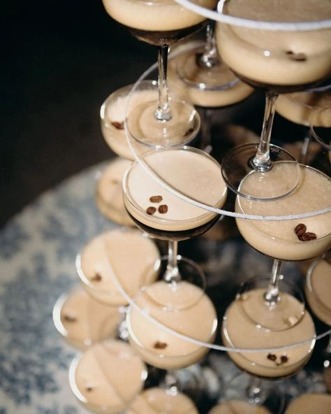 A dazzling nighttime photo of a martini espresso tower at Le Galinier de Lourmarin in Provence, captured with dramatic flash photography. The tower of sleek martini glasses filled with rich espresso cocktails glistens under the light, creating a captivating focal point for this elegant wedding celebration. The warm tones of the espresso contrast beautifully with the crystal clarity of the glasses, while the flash highlights every luxurious detail. This refined and modern display perfectly complements the charm of a Provençal wedding, offering inspiration for couples seeking stylish and memorable reception details infused with sophistication and flair. Espresso Martini Wedding, Flash Photo, Espresso Martini, Wedding Cocktails, Martini, Wedding Inspo, Engagement Photos, Wedding Reception, Destination Wedding