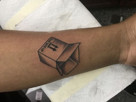 A Cardboard box tattoo Tattoo In Box Idea, Take Out Box Tattoo, Outside The Box Tattoo, Cardboard Box Tattoo, Think Outside The Box Tattoo Ideas, Box Tattoo Ideas, Box Tattoo, Moving Boxes, Body Modifications