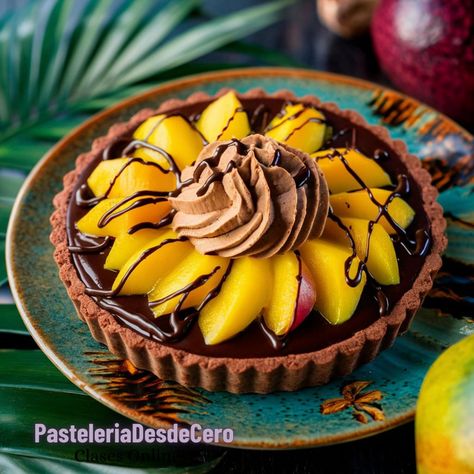 Chocolate Tart with Mango and Peanut Cream Ingredients: For the Crust: 1 1/2 cups crushed chocolate cookies (such as Oreos) 1/4 cup unsalted butter, melted For the Filling: 8 ounces dark chocolate, chopped 1/2 cup heavy cream 1/4 cup creamy peanut butter 2 tablespoons honey 1 ripe mango, peeled and sliced thinly For the Topping: 1/4 cup peanuts, chopped Fresh mint leaves (optional) Instructions: Prepare the Crust: In a bowl, combine the crushed chocolate cookies and melted butter. Mix un... Chill Place, Peanut Butter And Honey, Mango Slices, Mango Chocolate, Ripe Mango, Fresh Mint Leaves, Chocolate Tart, Decadent Chocolate, Creamy Peanut Butter